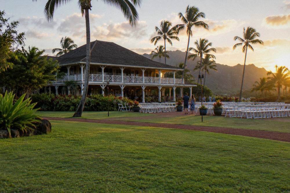 Historic plantation estate building with a wide lawn set for an evening event