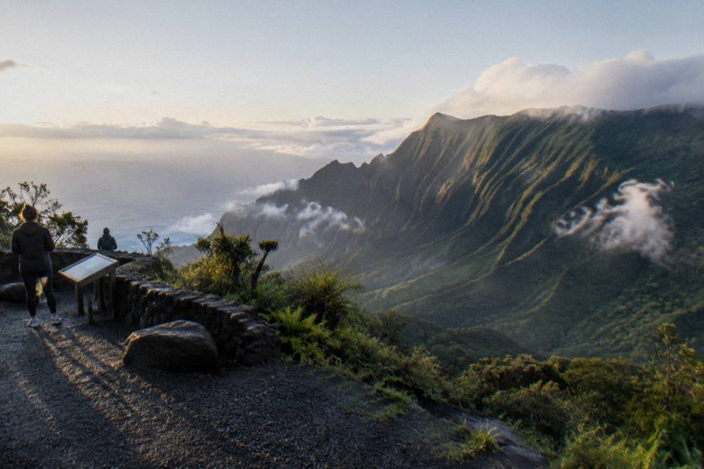 Canyon lookout in early morning light with long shadows across red ridges